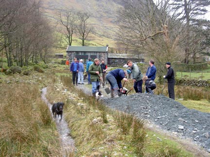 Laying the gravel with 'help' from the dogs!