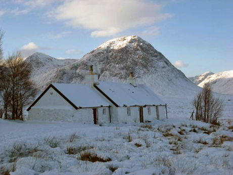 Blackrock Cottage with sunlight on Buchaille Etive Mor 